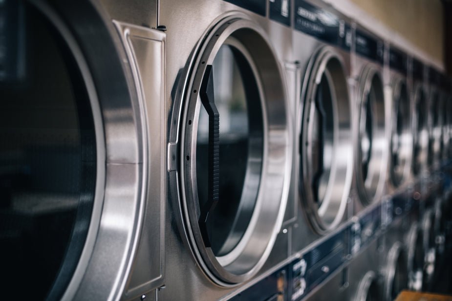 Commercial laundrette with multiple front-loading washing machines