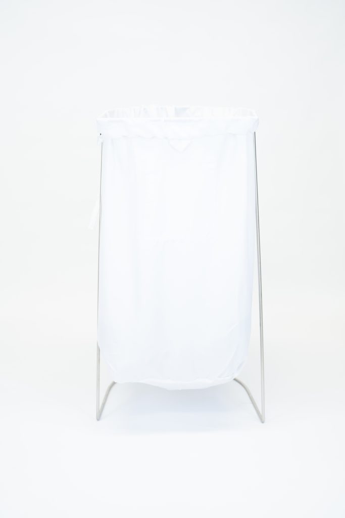 Heavy-duty nylon commercial laundry bag with drawstring closure for hospitality