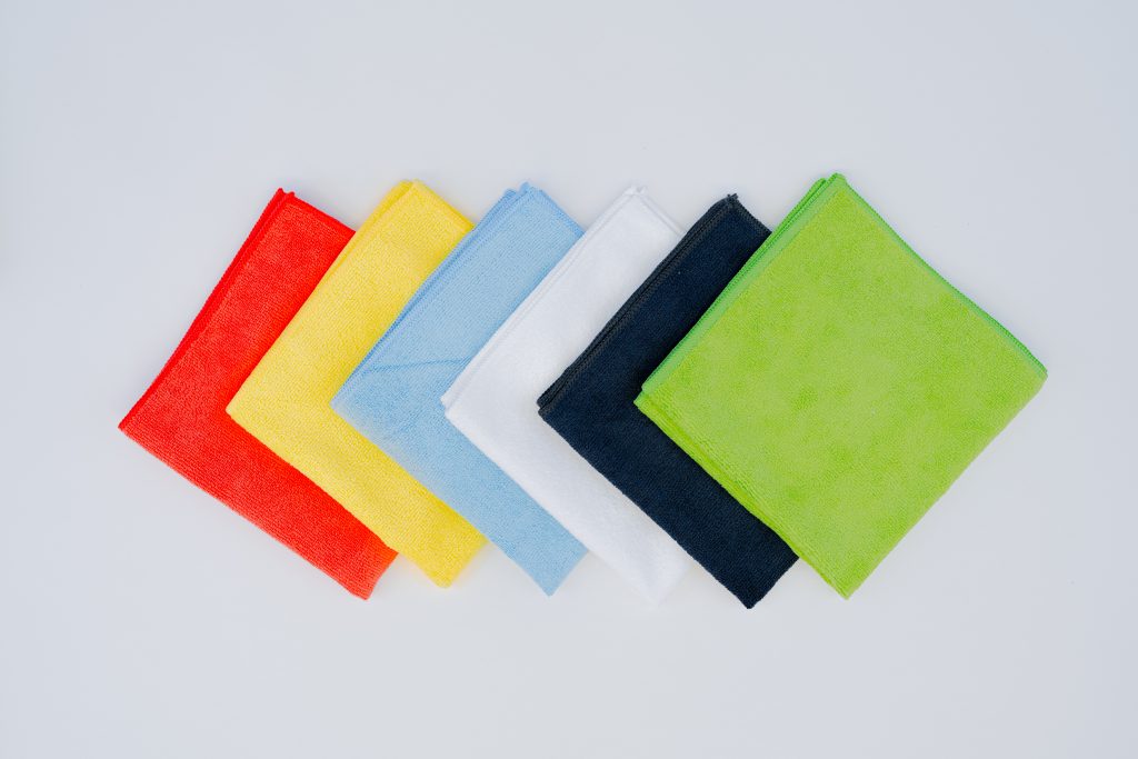 Microfibre cleaning cloths in white, yellow, blue, red, black, and green for commercial use