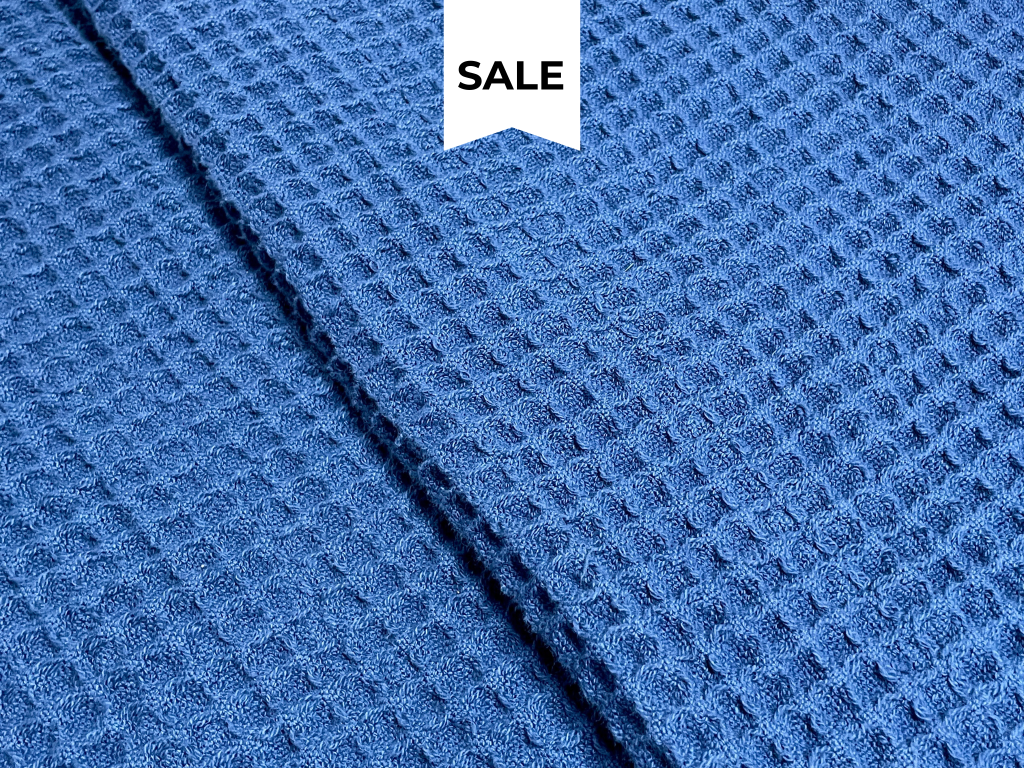 Navy waffle blanket with textured weave for stylish bedroom layering