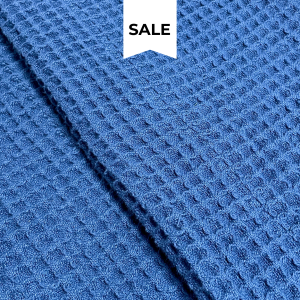 Navy waffle blanket with textured weave for stylish bedroom layering