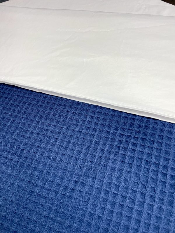 Navy waffle blanket with textured weave for stylish bedroom layering