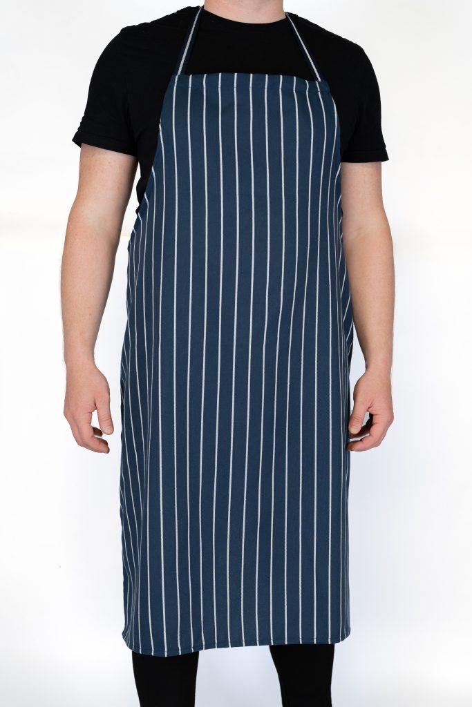 Commercial chef apron with adjustable neck strap for hospitality and kitchen use