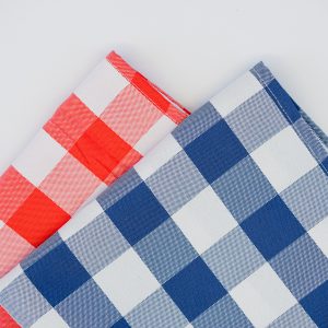 Blue and red gingham tablecloths displayed side by side for cafes and restaurants