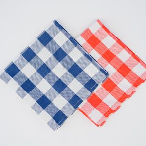 Blue and red gingham tablecloths displayed side by side for cafes and restaurants